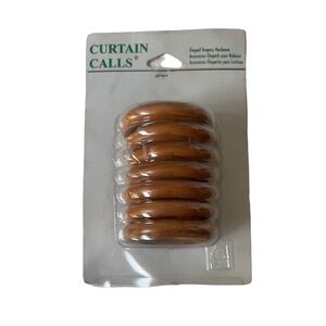 New- 9 oak drapery rings with hooks.